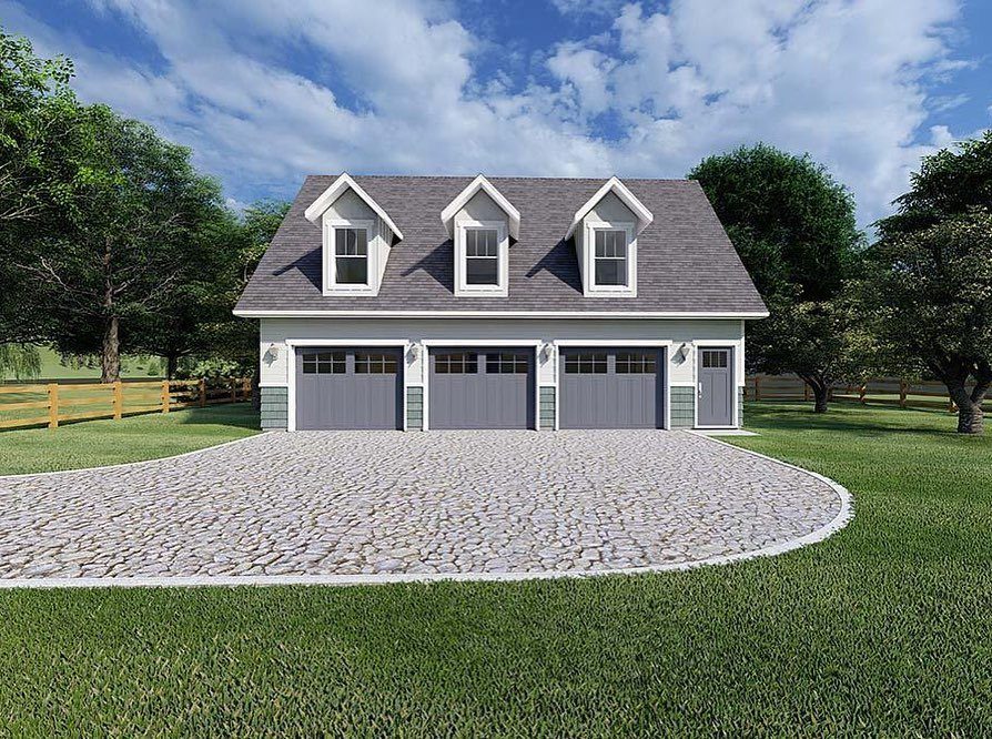 A two-story building with a three-car garage on the bottom and three dormer windows above.