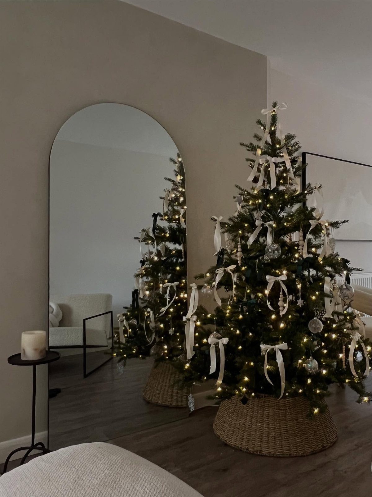 Christmas Tree Decor Ideas for 2025: 17 Fresh Styles from Coastal to Candyland 2 Decorated Christmas tree with white ribbons and fairy lights in a wicker basket.