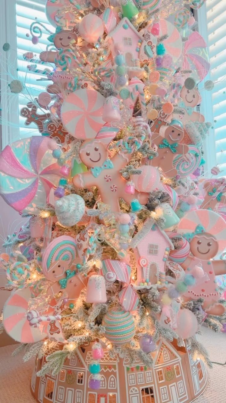 Christmas Tree Decor Ideas for 2025: 17 Fresh Styles from Coastal to Candyland 12 A pastel Christmas tree decorated with colorful lollipops, gingerbread men, and soft-colored ornaments.