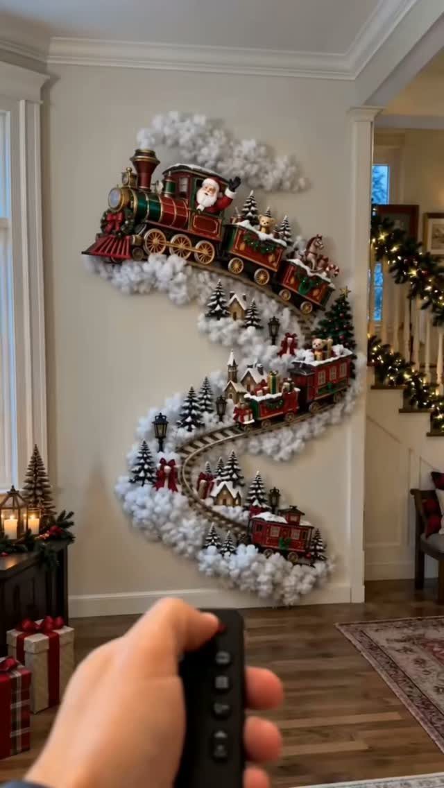 Christmas Wall Decor Ideas: 9 Ways to Dress Vertical Space 3 A miniature Christmas train traveling through snowy white clouds and tiny houses on a wall.