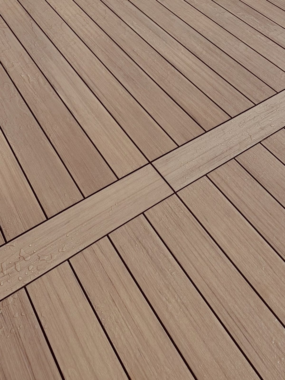 Composite Wood Deck 13 Ideas for Plans, Patterns and Colors 2 Light brown composite wood decking boards with a textured wood grain pattern laid in a geometric design.