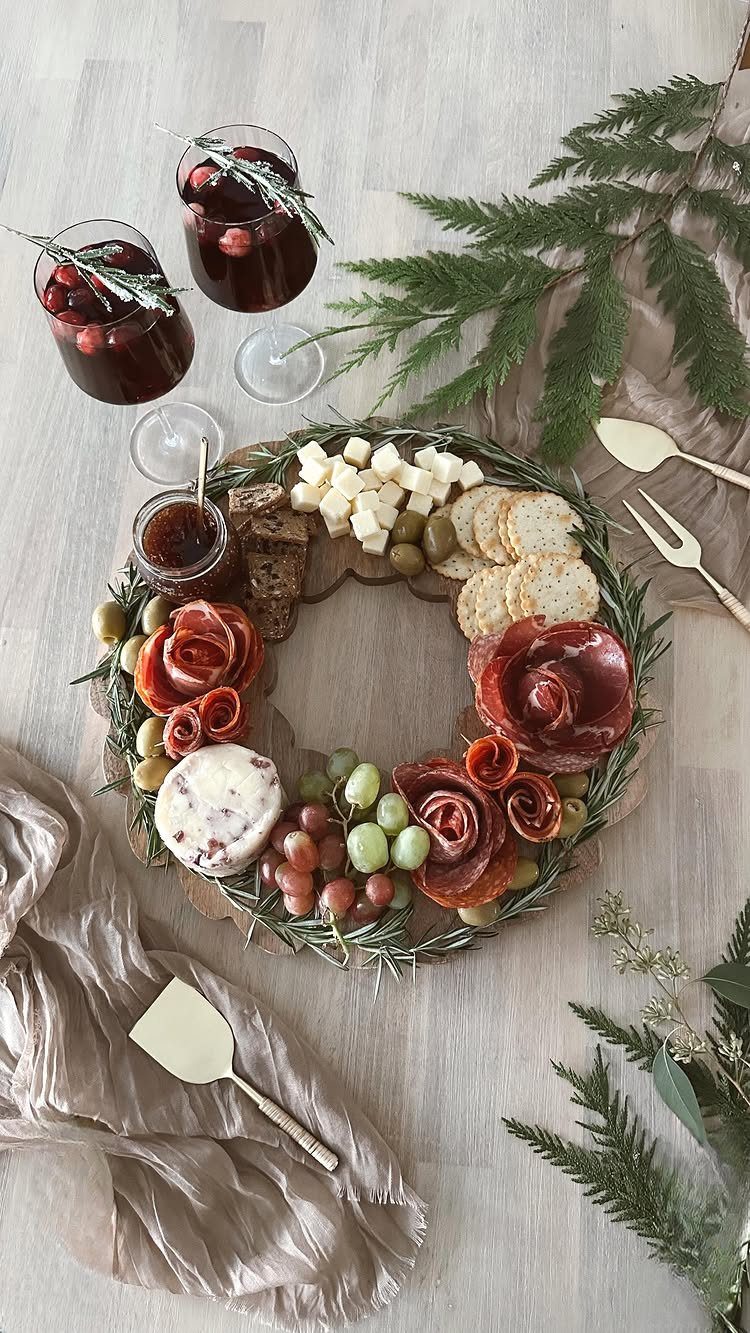 32 Easy Christmas Party Ideas for Food, Drinks, and Hosting in 2026 7 A festive charcuterie wreath with cheese, meats, and grapes arranged on a wooden board.