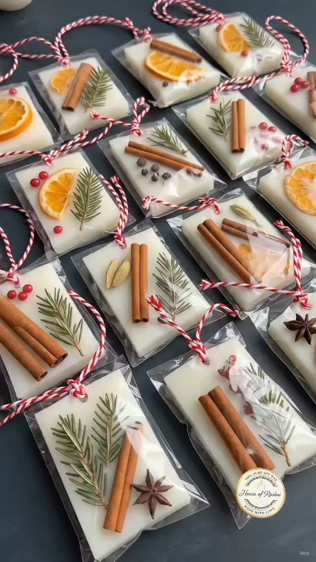 17 Easy DIY Christmas Gifts: Handmade Presents for Every List 14 White wax melts decorated with cinnamon, orange slices, and greenery, wrapped in clear plastic with twine.