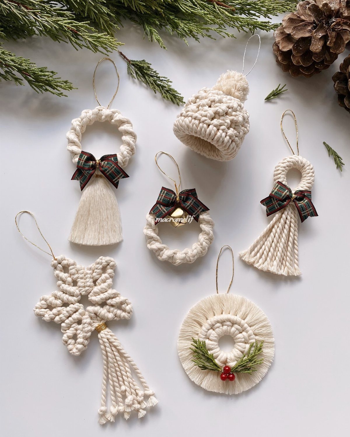 26 Handmade Ornaments: DIY Projects from Paper to Pinecones 16 Cream macrame Christmas ornaments in star, wreath, and hat shapes on a white background.